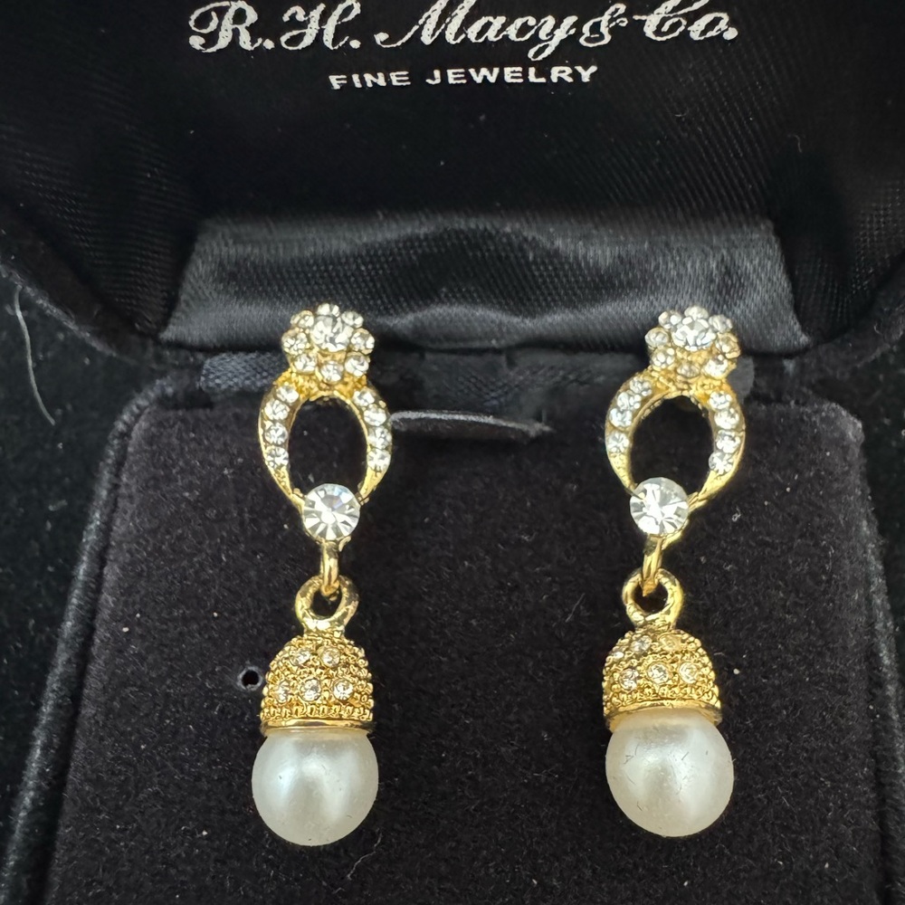 Elegant Gold tone with cubic zirconia and pearl drop earrings.
